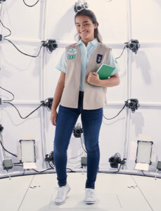 girl modeling new Girl Scouts uniform design by FIT